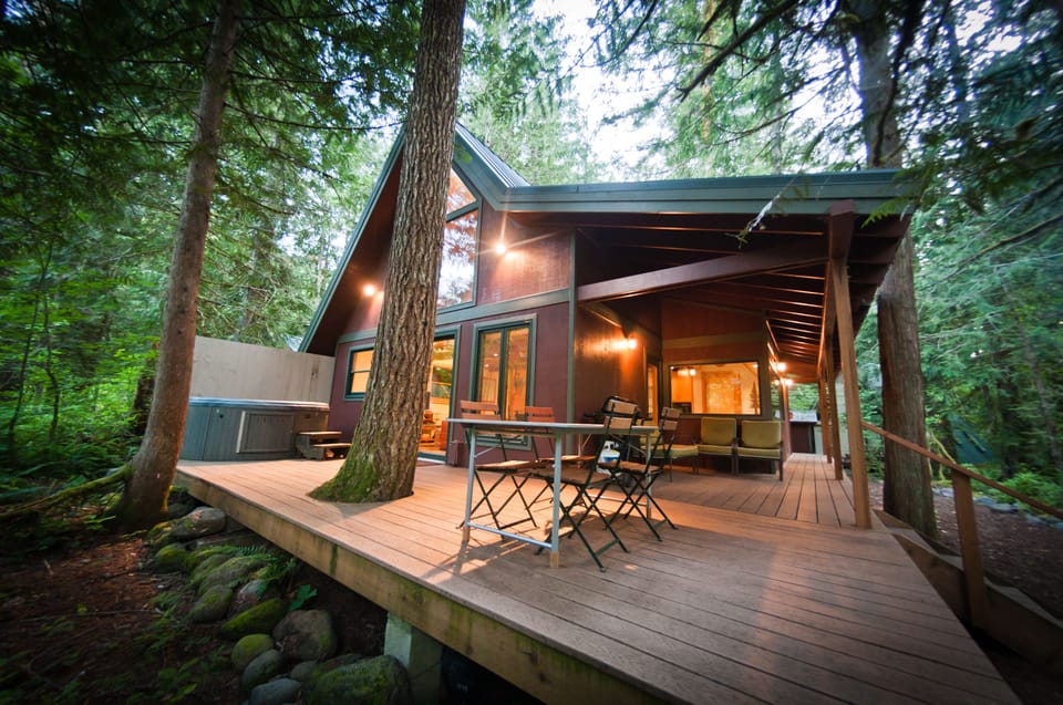 Back Deck w/ Hot Tub, Table & Bbq. Fire pit & Creek at the bottom of the Stairs 