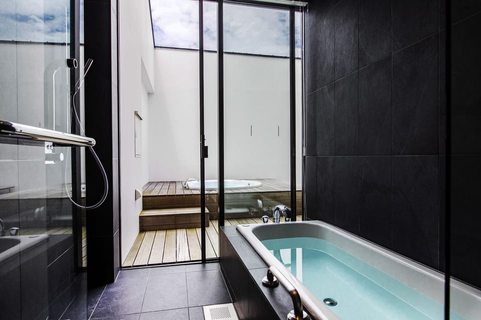 Deluxe Twin Room, Jetted Tub | Bathroom | Free toiletries, hair dryer, bathrobes, slippers