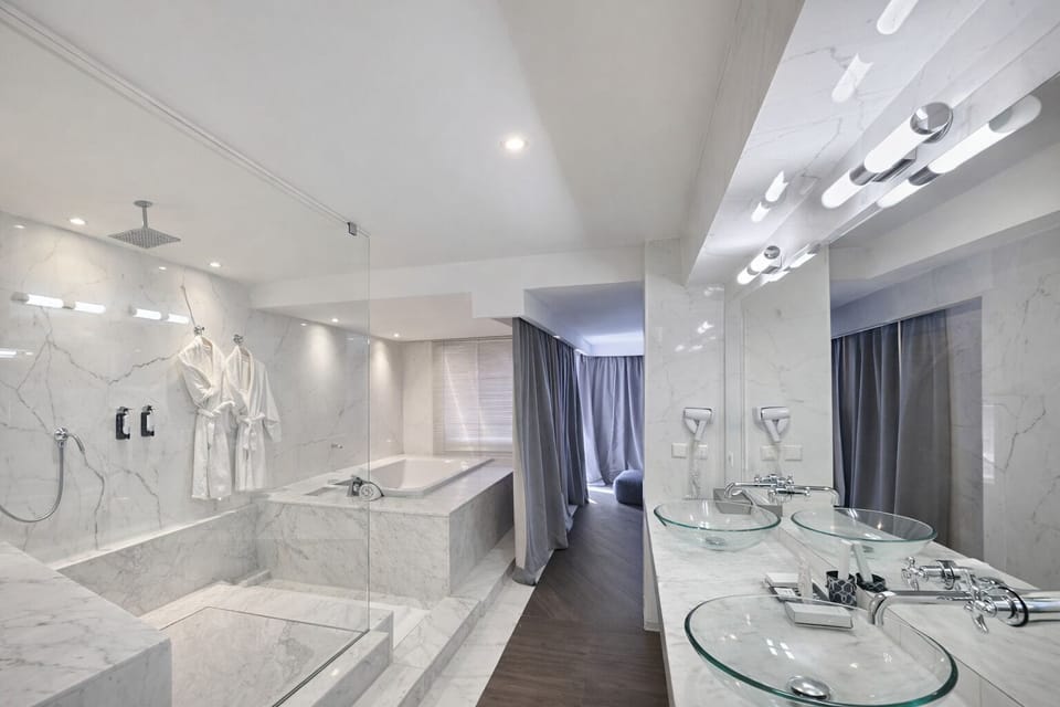 Executive Suite | Bathroom | Designer toiletries, hair dryer, bathrobes, slippers