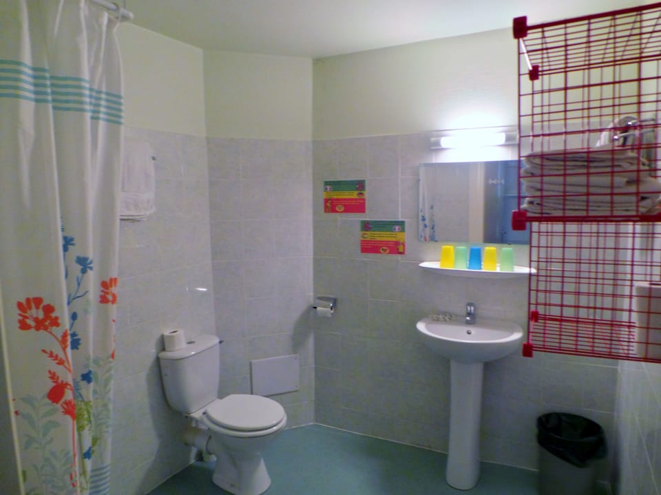 Quadruple Room | Bathroom | Shower, hair dryer, slippers, towels
