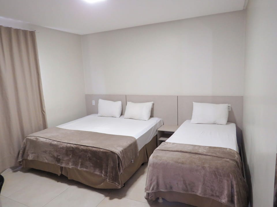 Family Triple Room | Desk, laptop workspace, blackout drapes, free WiFi