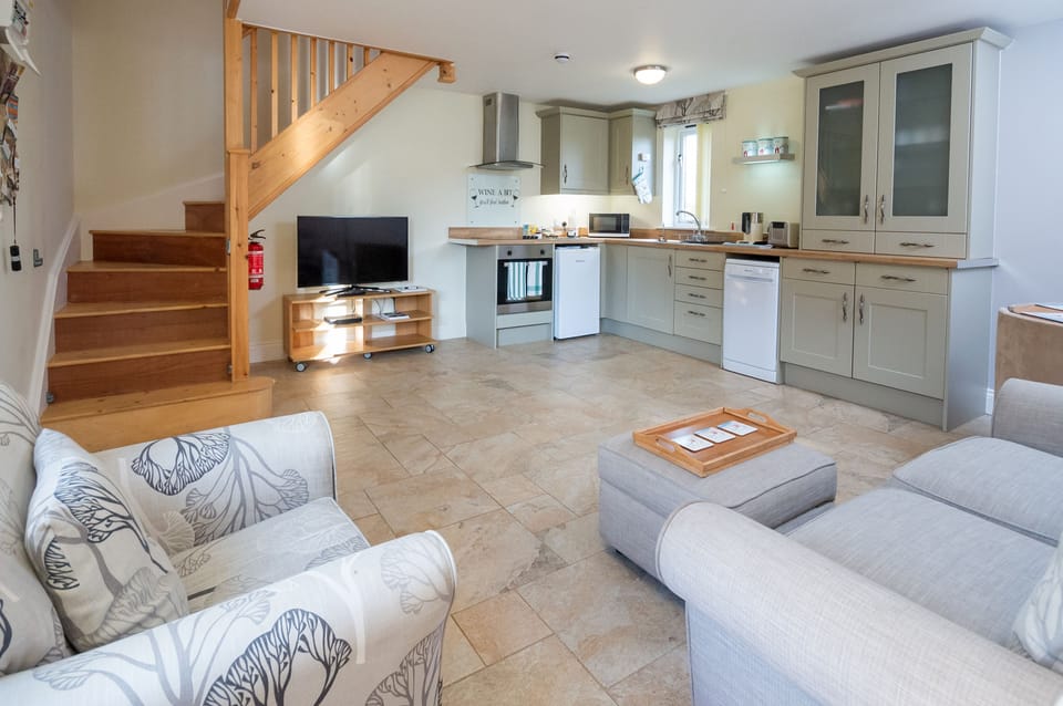 Luxury Cottage, 1 Bedroom, Garden View | Living area | Flat-screen TV, DVD player, heated floors