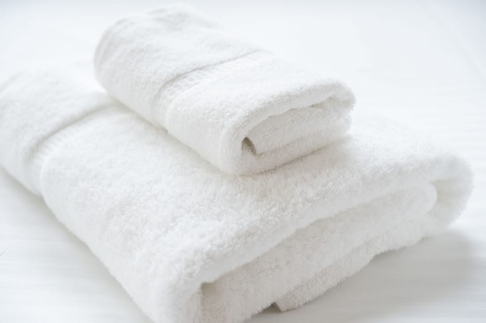 Combined shower/tub, free toiletries, hair dryer, slippers