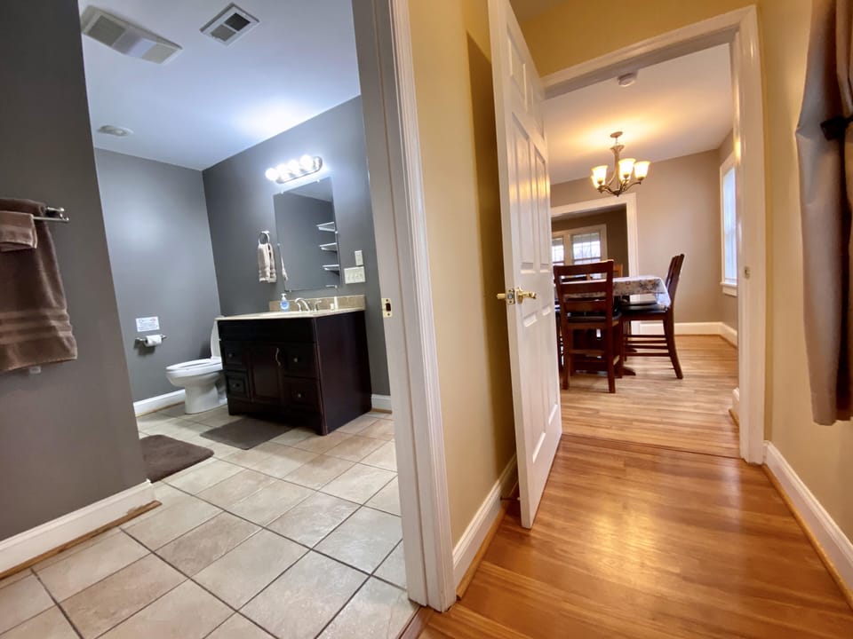 Master Bath on First Floor and View of Dining Room off Master Bedroom
