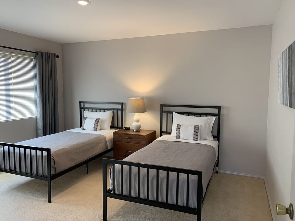 Twin bedroom is spacious and comfortable but has no TV