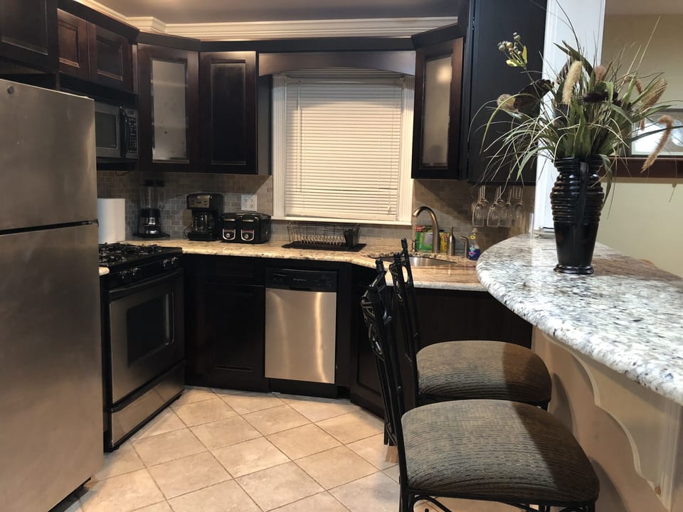 Modern kitchen-dishwasher, stove, refrigerator, blender, coffee maker, toaster