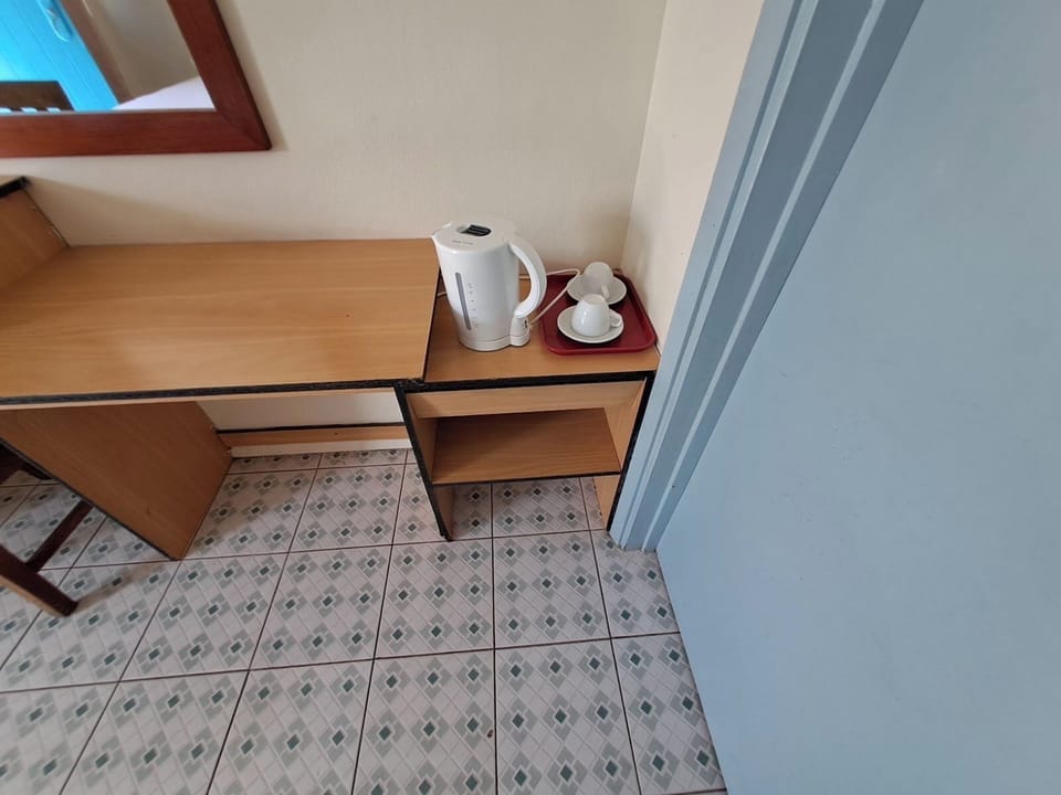 Standard Room With Air Conditioning | Desk, iron/ironing board, bed sheets