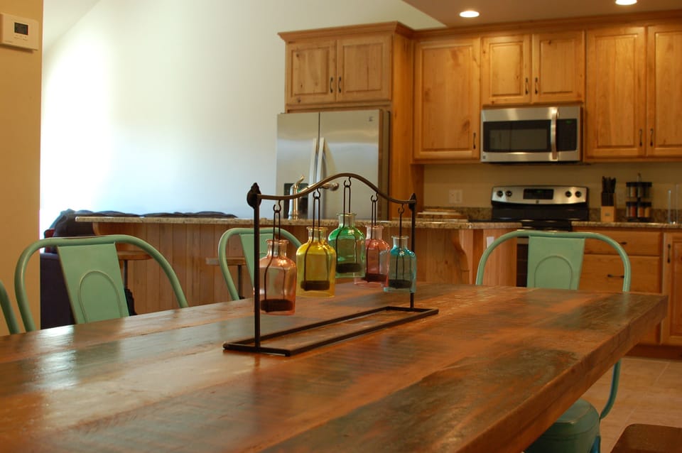 Dining table and kitchen give you a great indoor place to eat - fits 8 easily