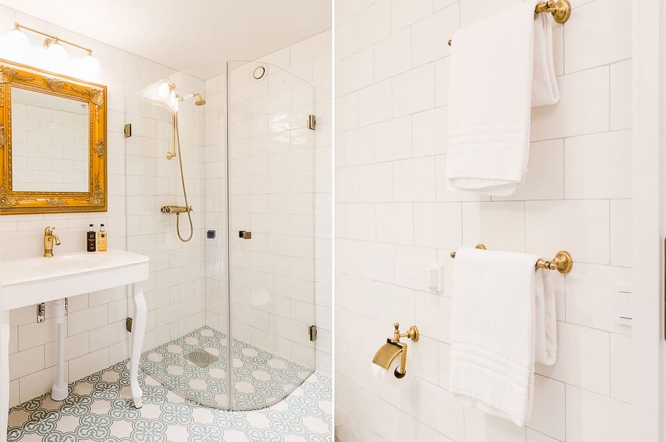 Deluxe Double Room, 1 Queen Bed | Bathroom | Shower, slippers, towels