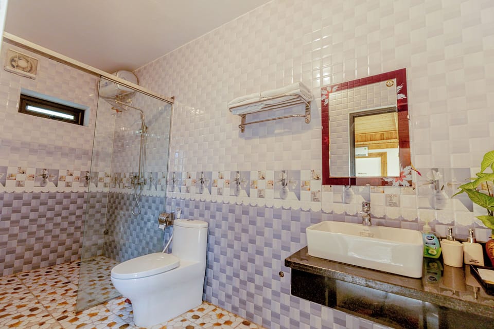 Shower, free toiletries, hair dryer, slippers