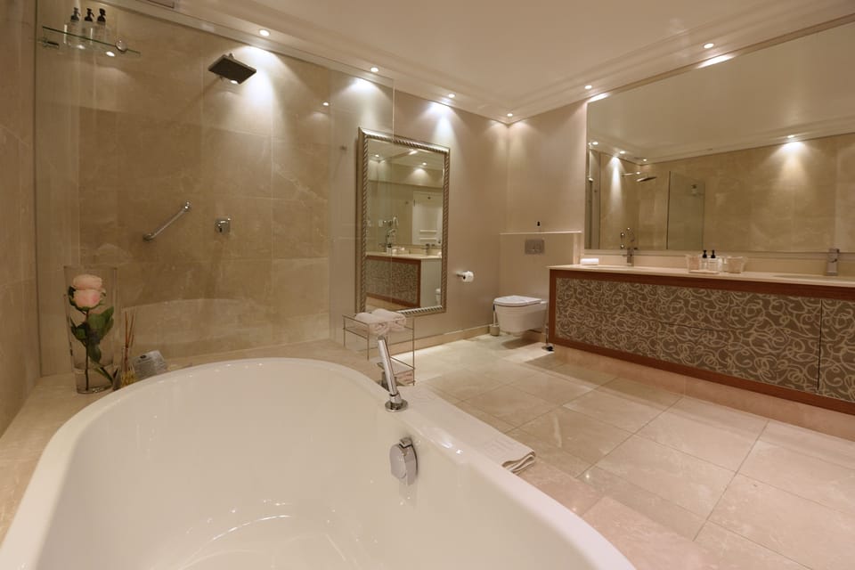 Superior Suite | Bathroom | Separate tub and shower, designer toiletries, hair dryer, bathrobes