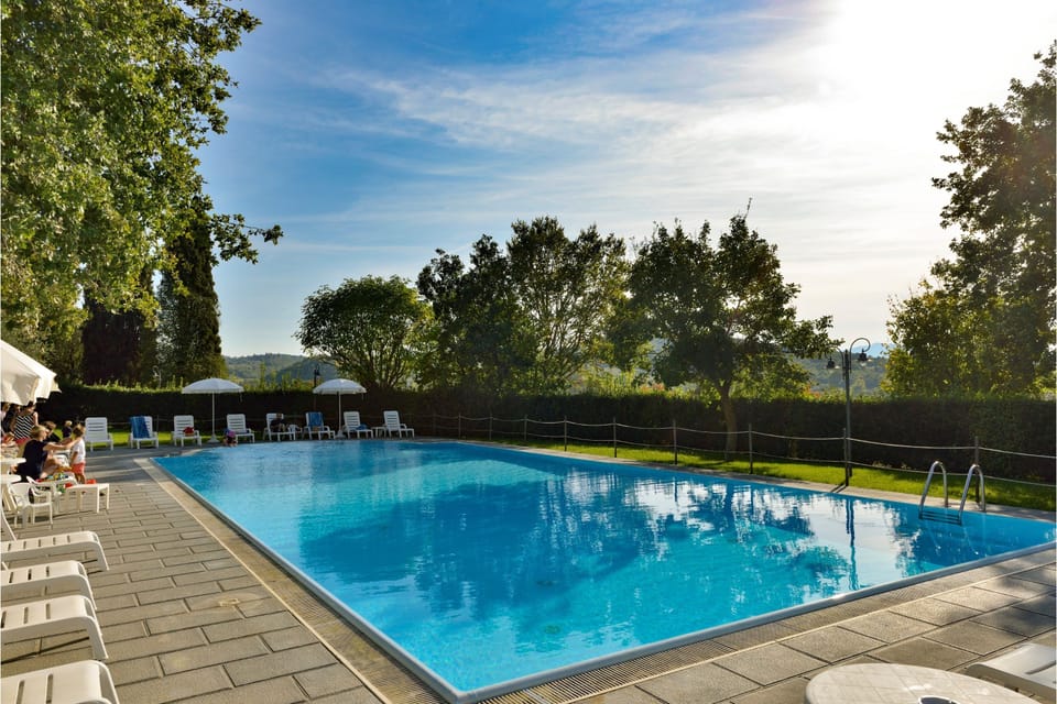 Outdoor pool, pool umbrellas, sun loungers