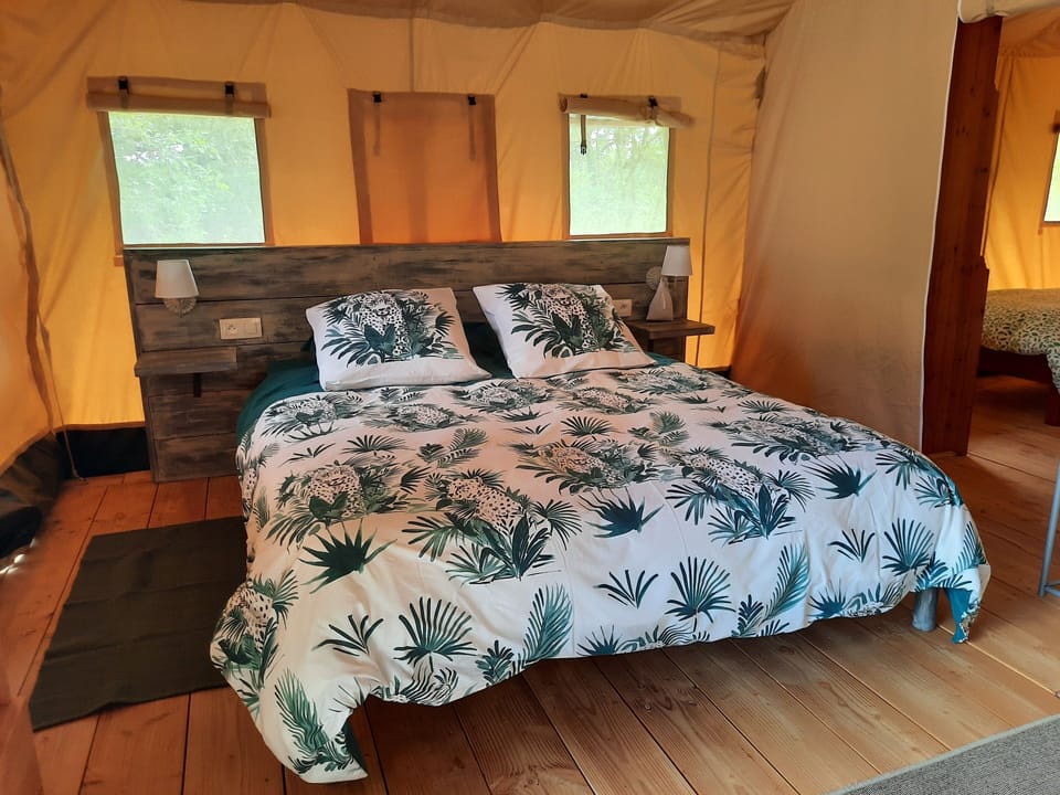Deluxe Tent | Down comforters, individually decorated, individually furnished