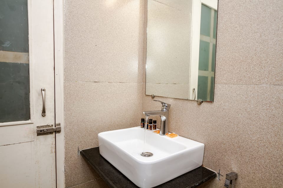 Basic Double Room, 1 King Bed, Mountain View | Bathroom | Shower, rainfall showerhead, designer toiletries, hair dryer