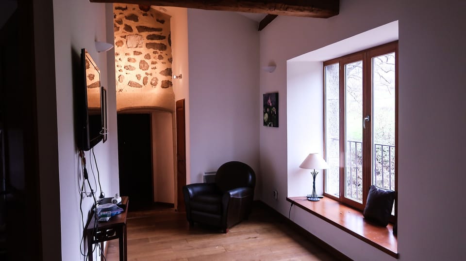 Upstairs games/TV room, with a view over the meadow behind the house...