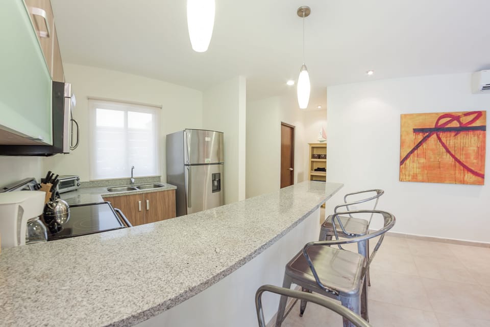 Apartment, 2 Bedrooms | Private kitchen | Fridge, microwave, stovetop, coffee/tea maker
