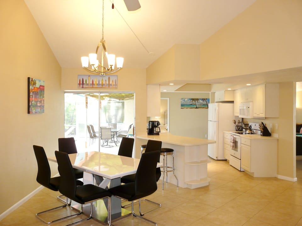 Dining area seats 8 (6 on dining table, 2 on counter top with bar stools.