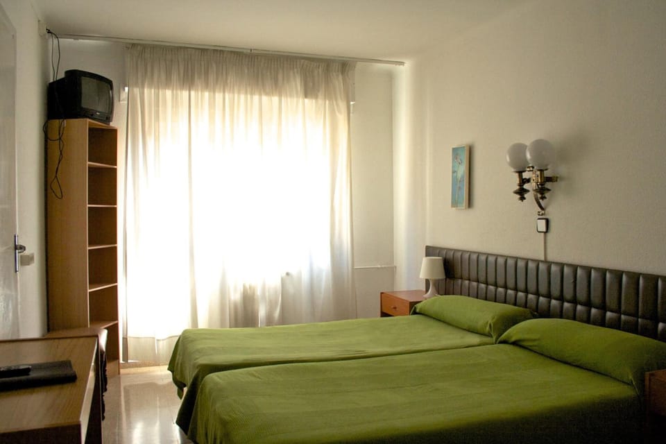 Blackout drapes, free WiFi, bed sheets