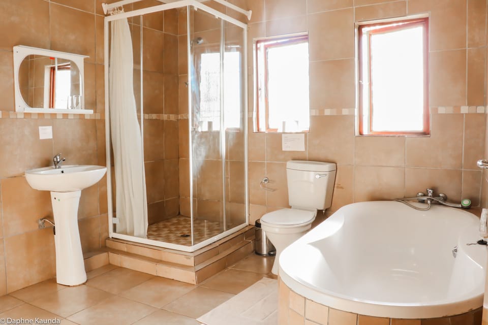 Deluxe Double Room, 1 Bedroom, Kitchenette, Garden View | Bathroom | Free toiletries, hair dryer, towels, toilet paper
