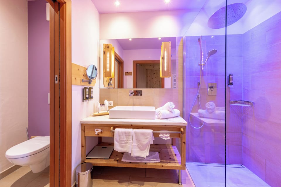 Rainfall showerhead, hair dryer, bathrobes, heated floors (bathroom)