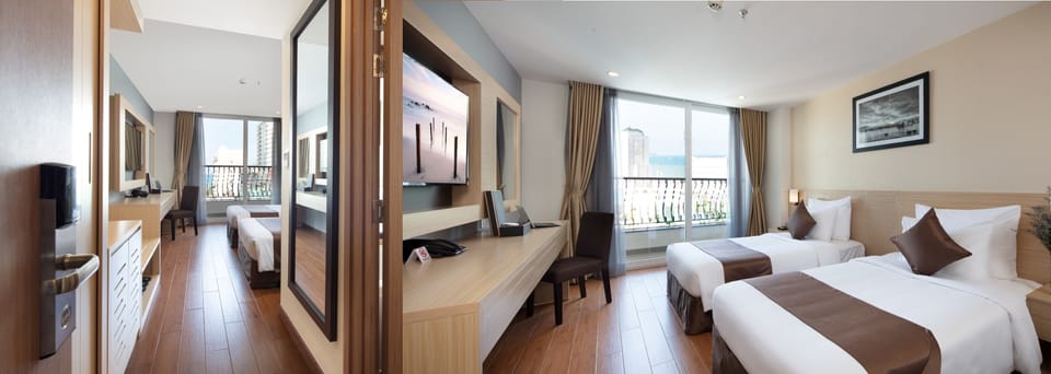 Family Room | Minibar, in-room safe, desk, iron/ironing board