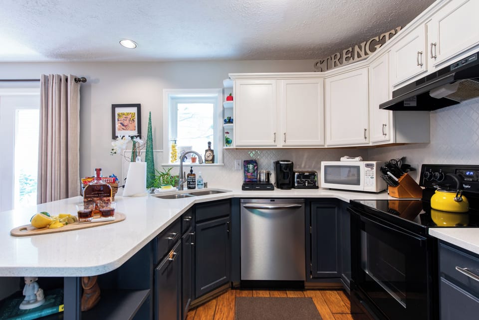 The newly renovated kitchen offers quartz countertops 
