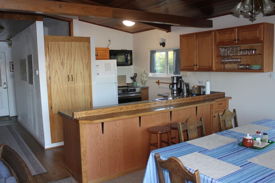 modern kitchen with lake view and breakfast bar
