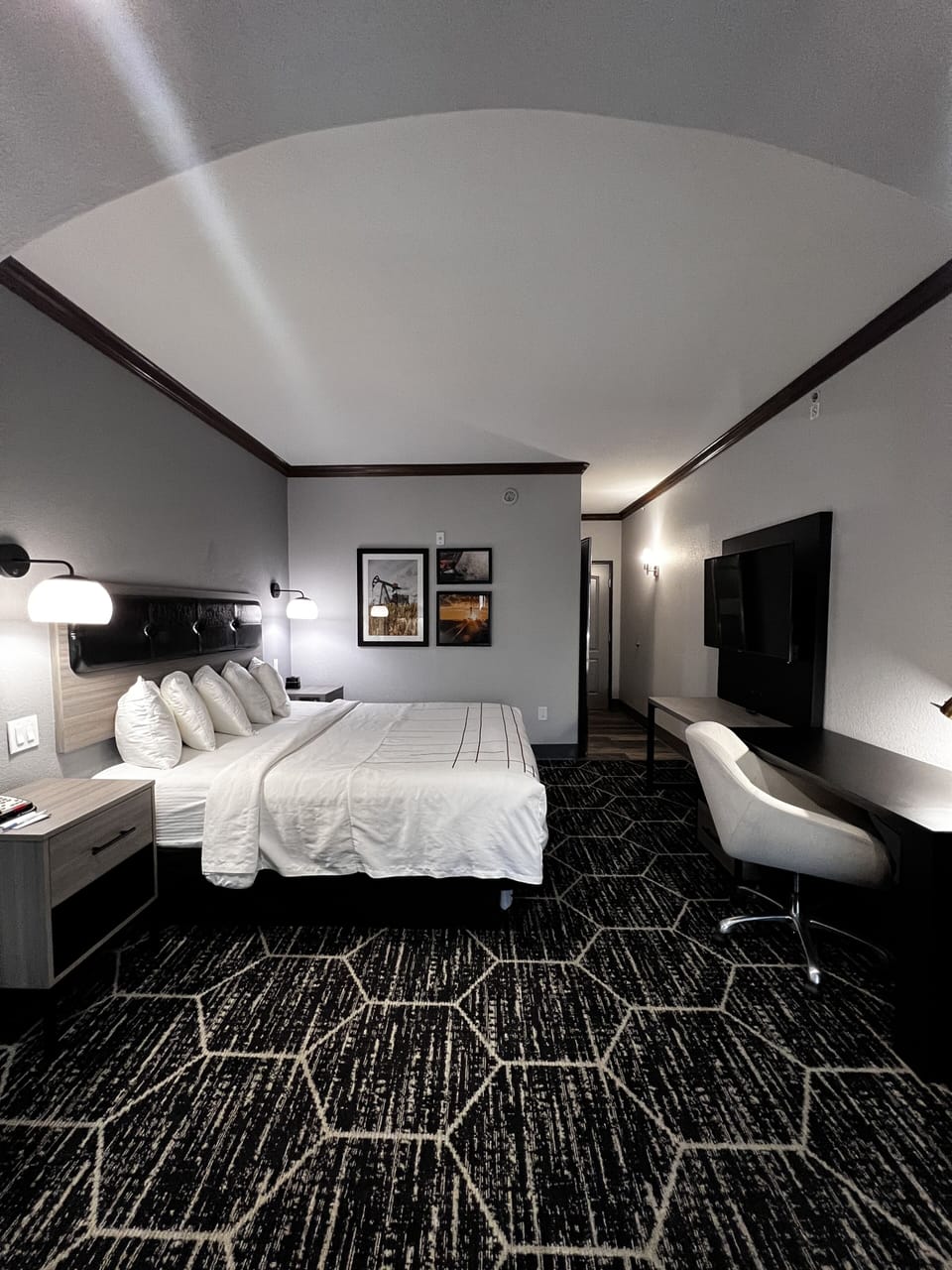 Premium bedding, desk, laptop workspace, blackout drapes