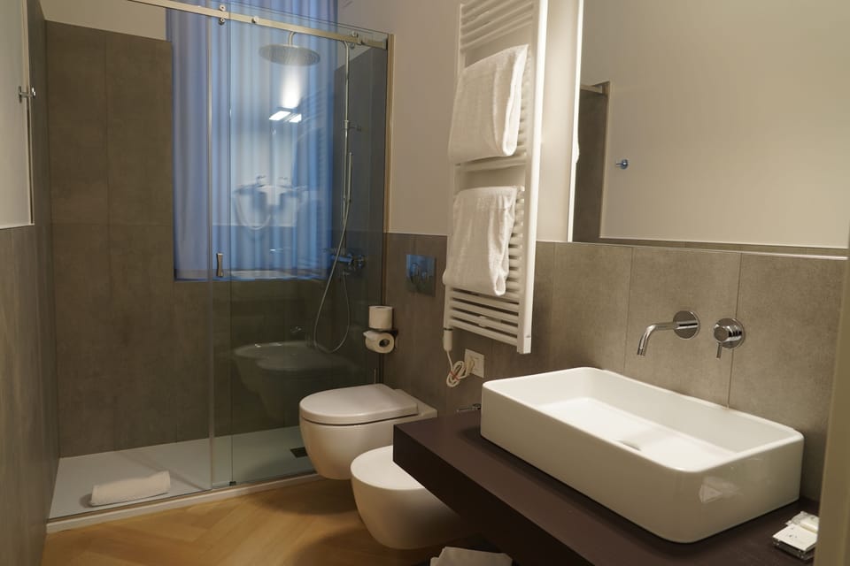 Shower, free toiletries, hair dryer, slippers