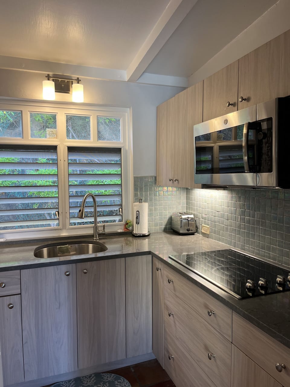The kitchen also has a drip coffee maker as well as a French press.