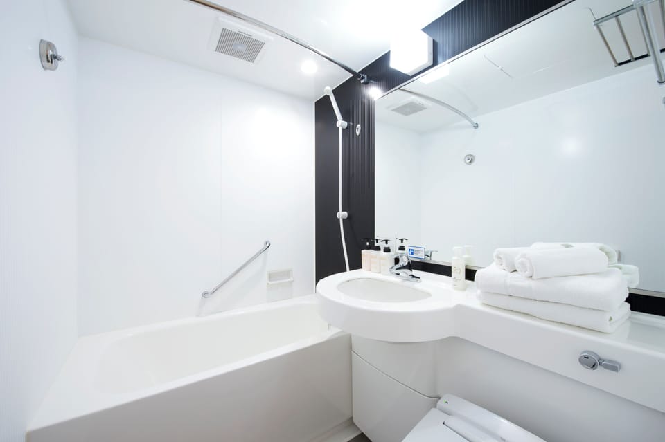 Combined shower/tub, free toiletries, hair dryer, slippers