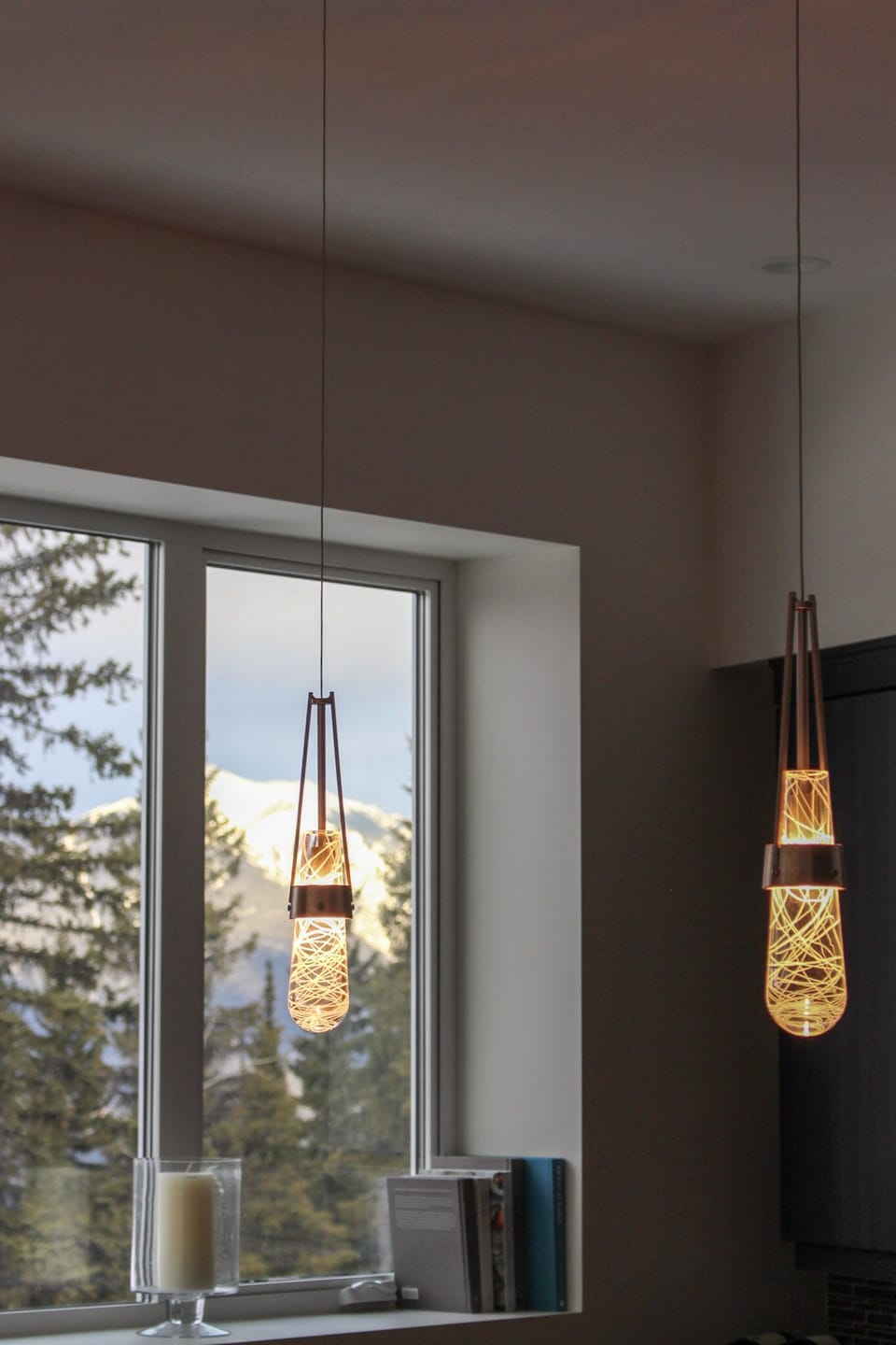 Details include handblown glass kitchen pendants from 