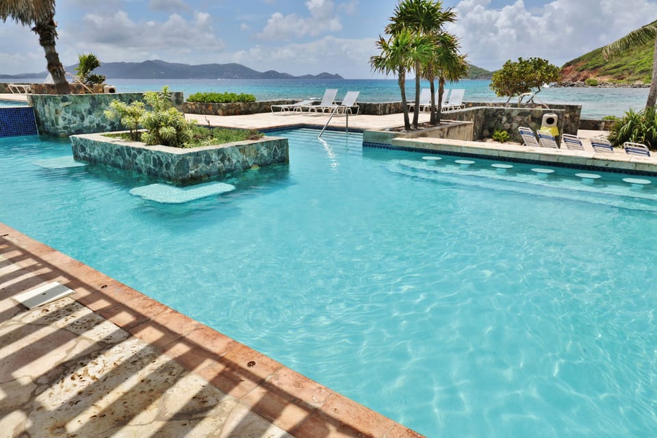  Ocean views from the two-tiered infinity 
pool, St. John off in the distance