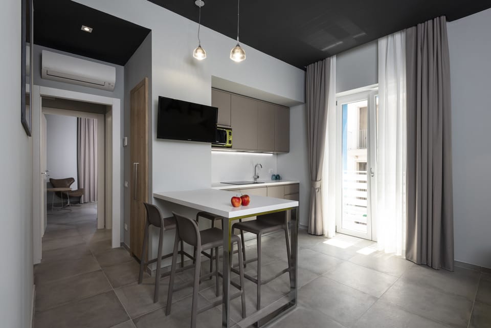 Apartment, 1 Bedroom | Minibar, individually furnished, desk, blackout drapes