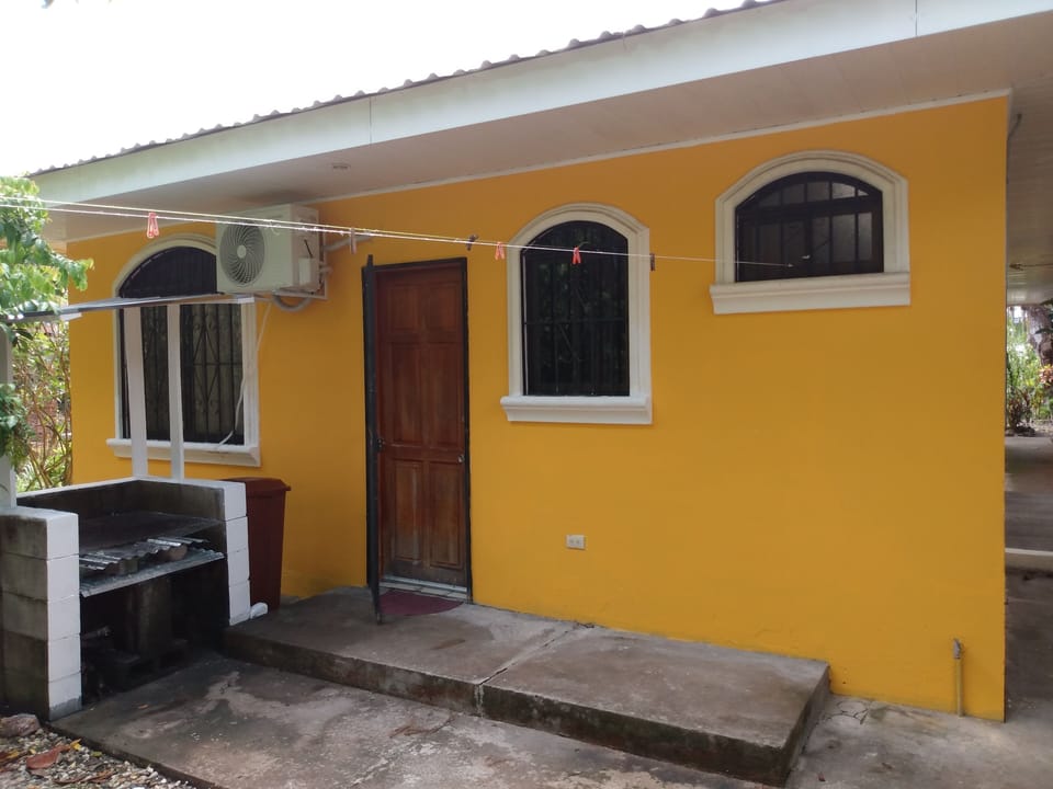 Back entrance with BBQ grill conveniently located.