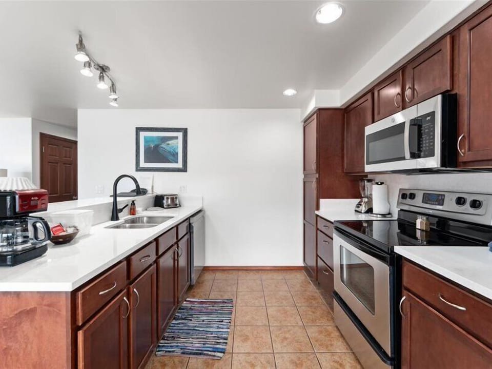 Your spacious kitchen features rich cherry cabinets, stainless steel appliances, and everything you need to prepare memorable meals during your stay.