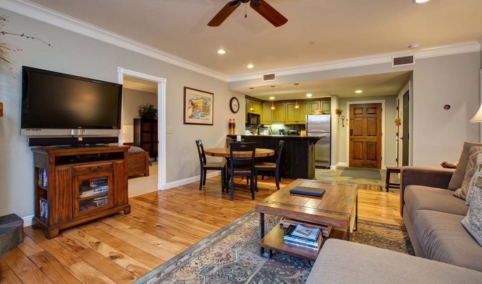Another view of the living/dining area, the big screen and entertainment center.