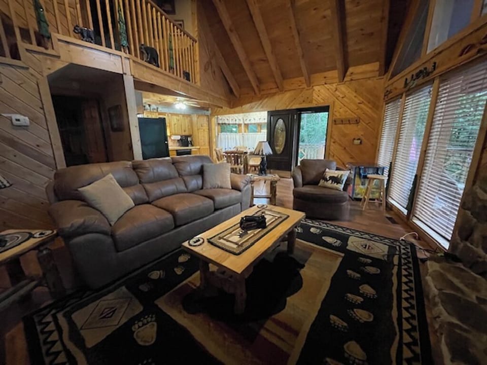 Living Room Has New Sofa Bed, Loveseat, Bear Lamps & Log Dining Tables