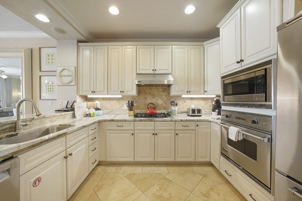 Views of the SPACIOUS with granite countertops and an adjacent dining room
