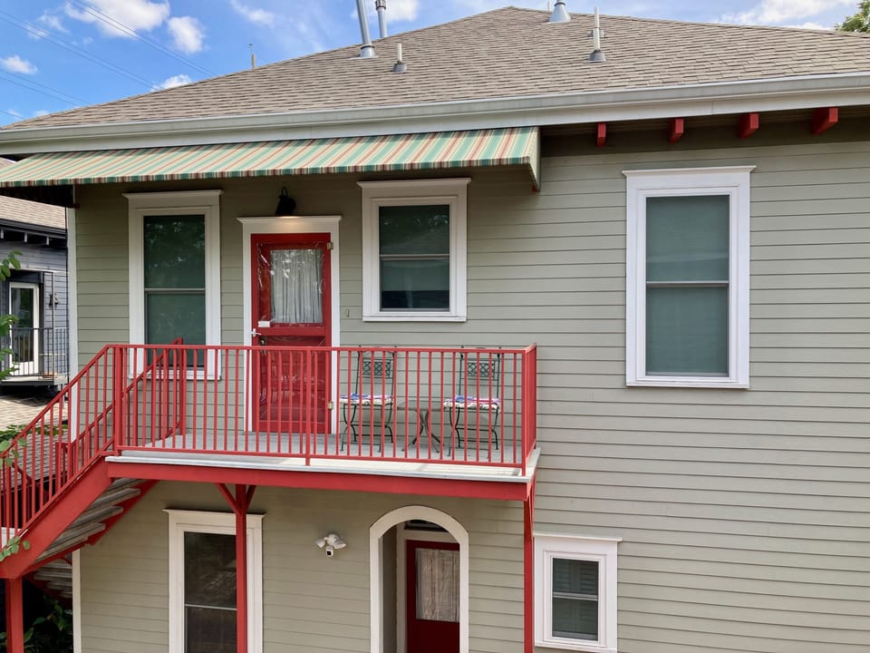 Hopkins House 2nd floor apartment private entry is off rear awning covered deck