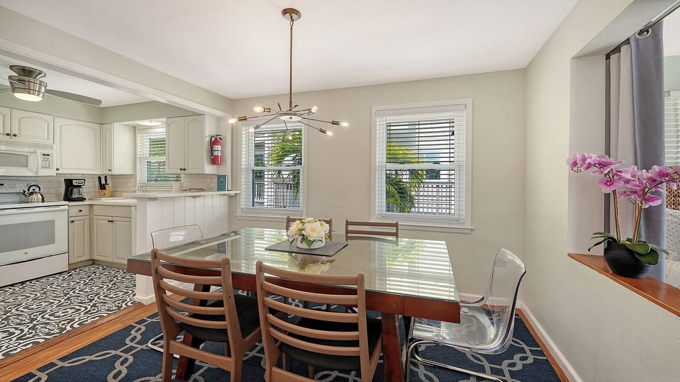 Dining area for six with an open floor plan, seamlessly connected to the kitchen