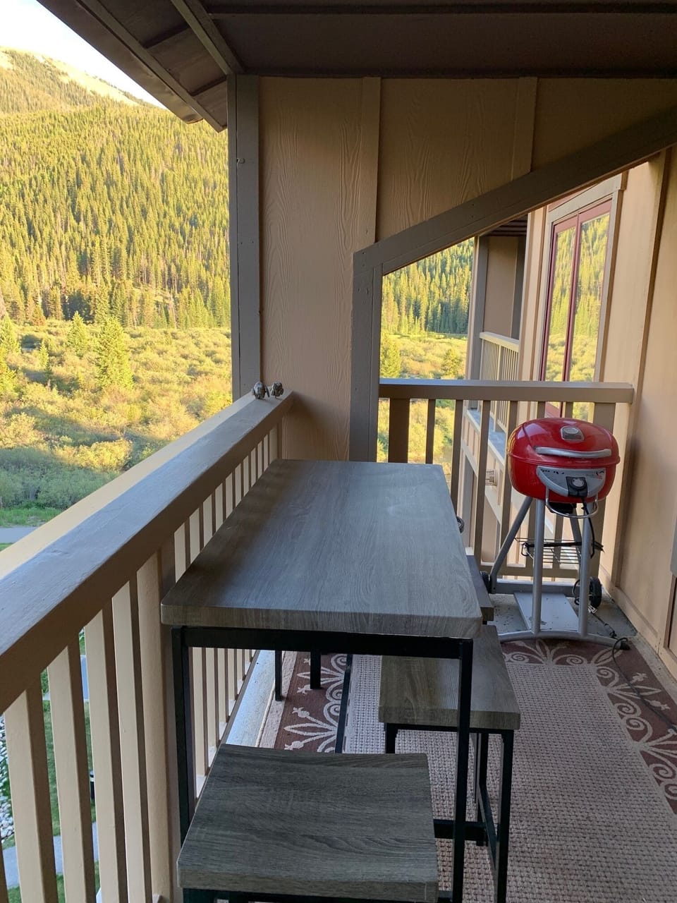 The deck has seating for four and an electric grill.