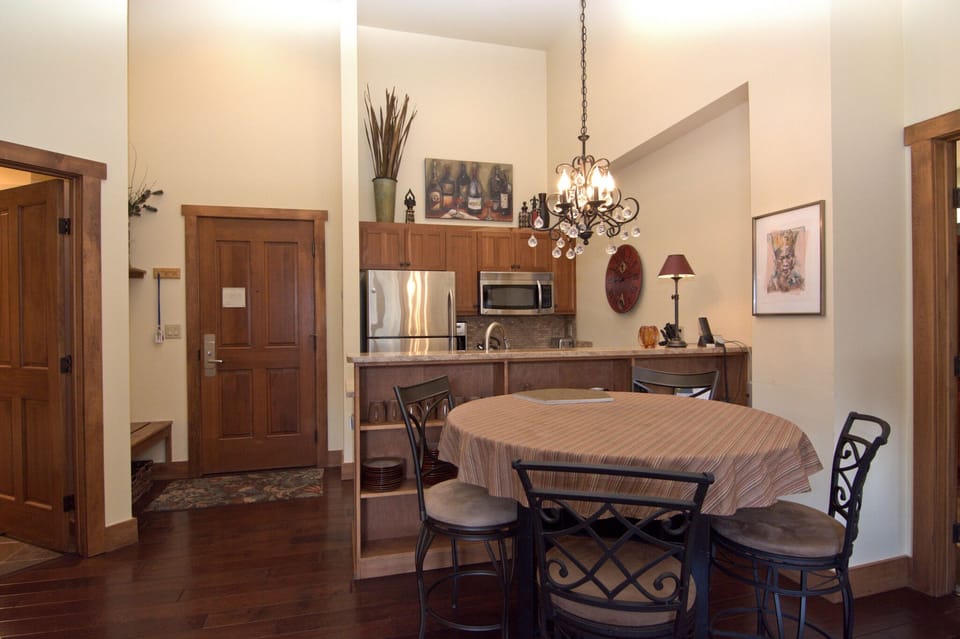 The dining has two additional chairs and seats six.