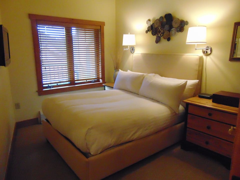 The second bedroom is super cozy and has its own flat panel TV.