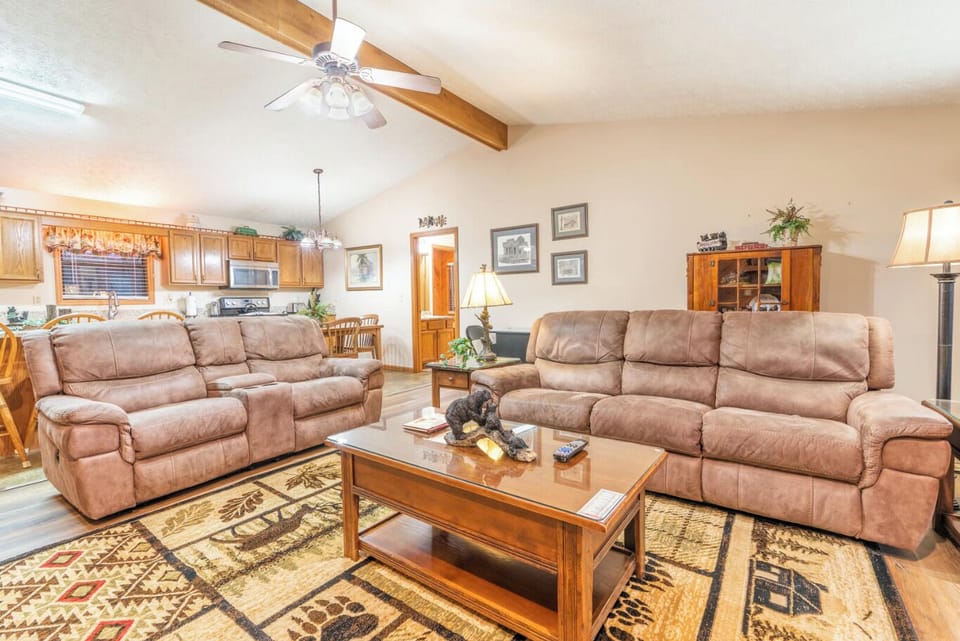 Looking from fireplace into living room and kitchen.