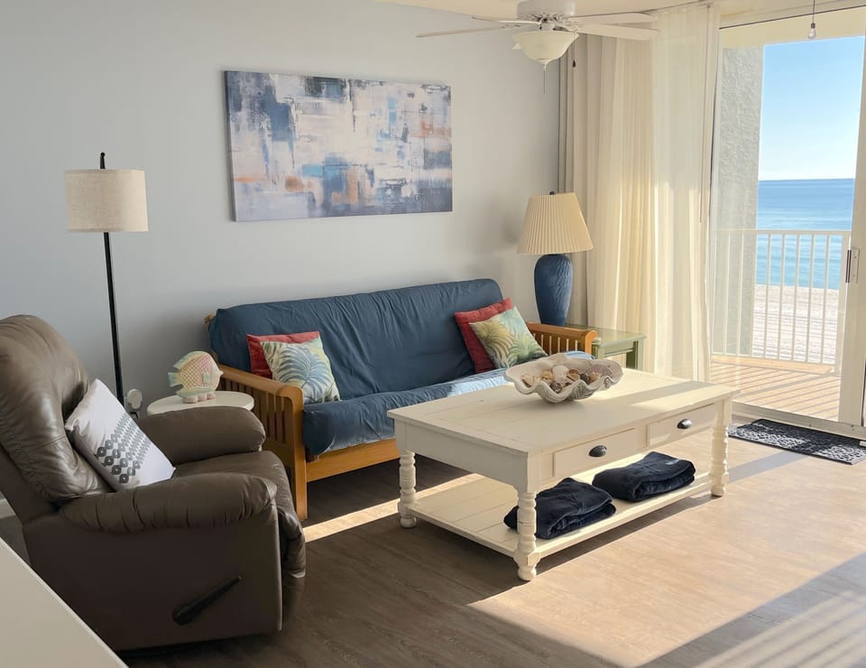 Comfortable seating in living room looking right out at the beach