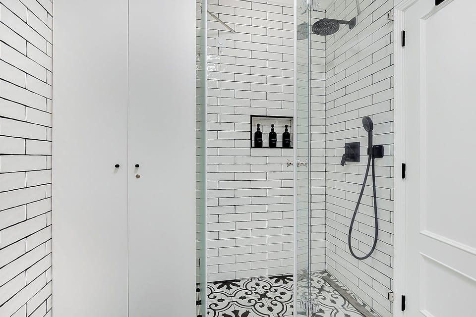 Luxury spa bathroom with heated floors, double head shower and towel warmer.