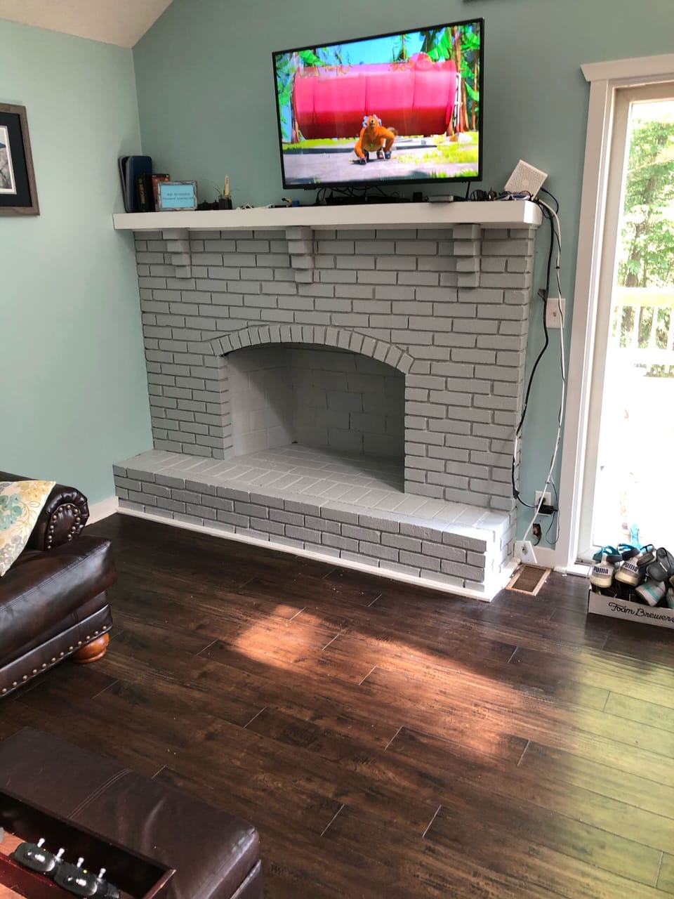 Decorative fireplace with flatscreen TV above. 