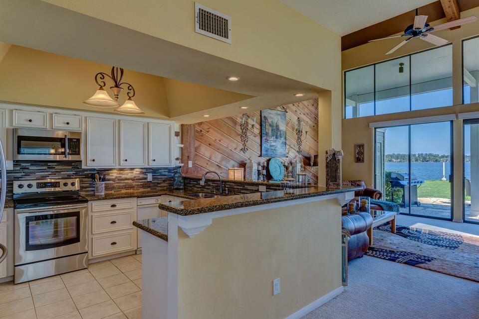 Enjoy cooking in this updated kitchen with full view of the lake.