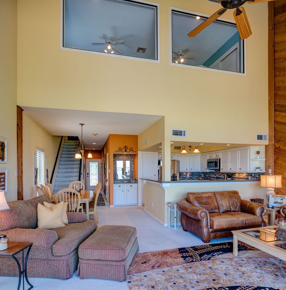 View of the condo from the patio. The third bedroom is seen on the second story